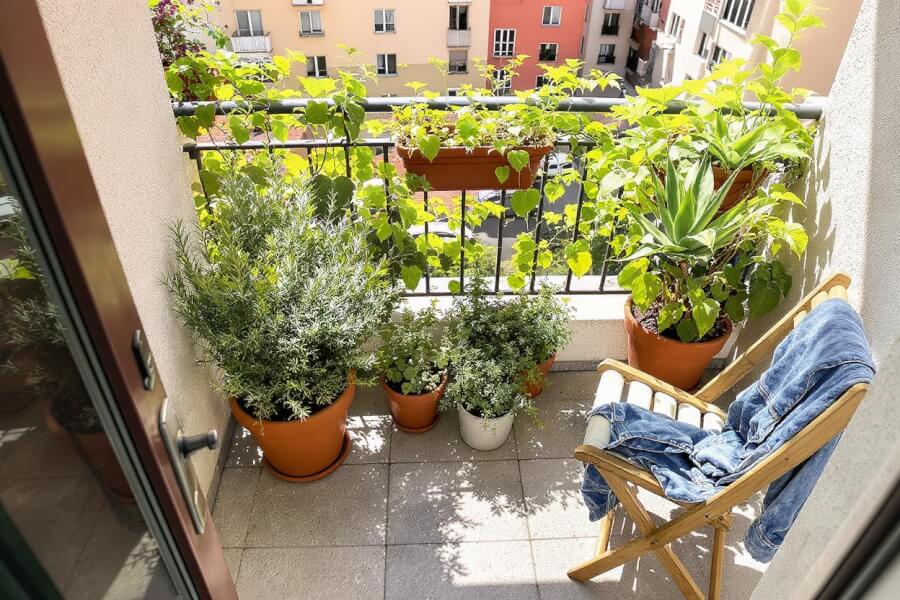 a picture of a balcony designed in a garden style